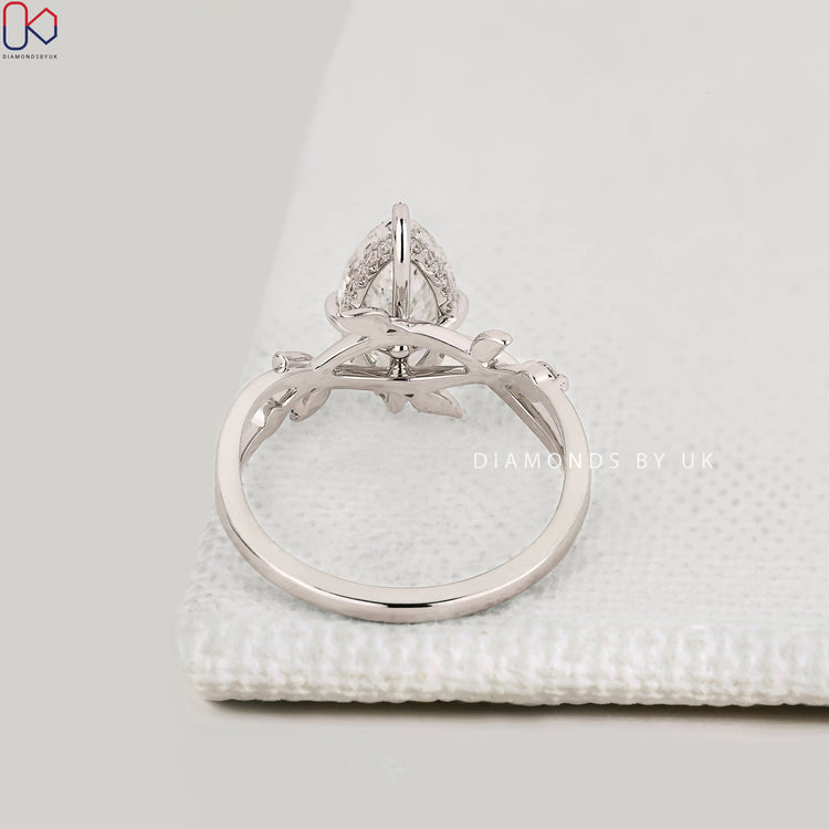 Handmade marquise engagement ring with milgrain details.
