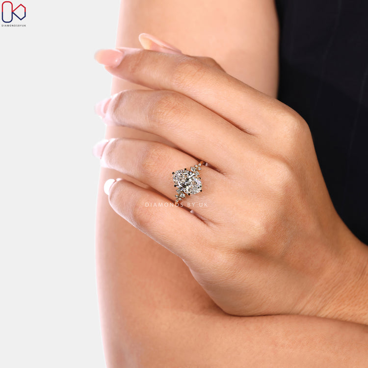 Vintage oval cut diamond ring with six claw prong setting.  
