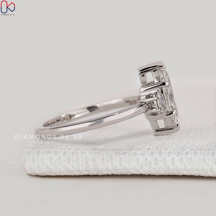 Handmade marquise ring with four claw prongs.