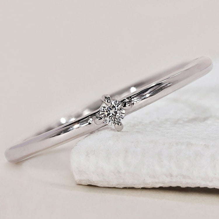Round diamond wedding band featuring a classic design for timeless elegance
