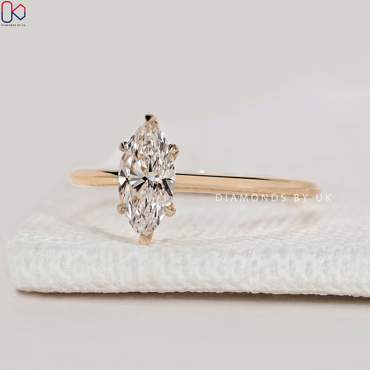 Handmade marquise cut ring with six claw prongs.