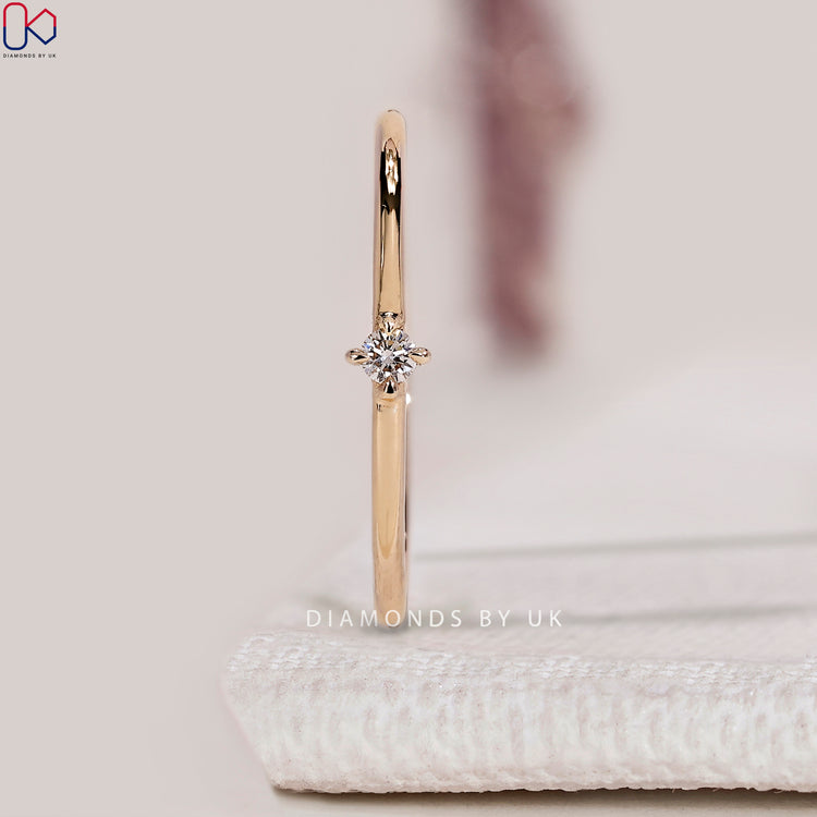 Lab grown round diamond band with compass prong setting.
