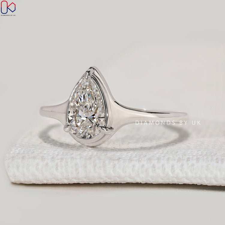 Handmade pear ring with three prong bezel setting.