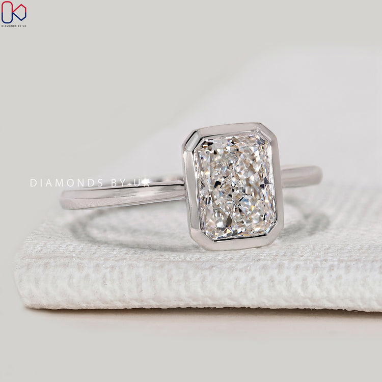 Radiant cut lab grown diamond ring with cathedral setting.
