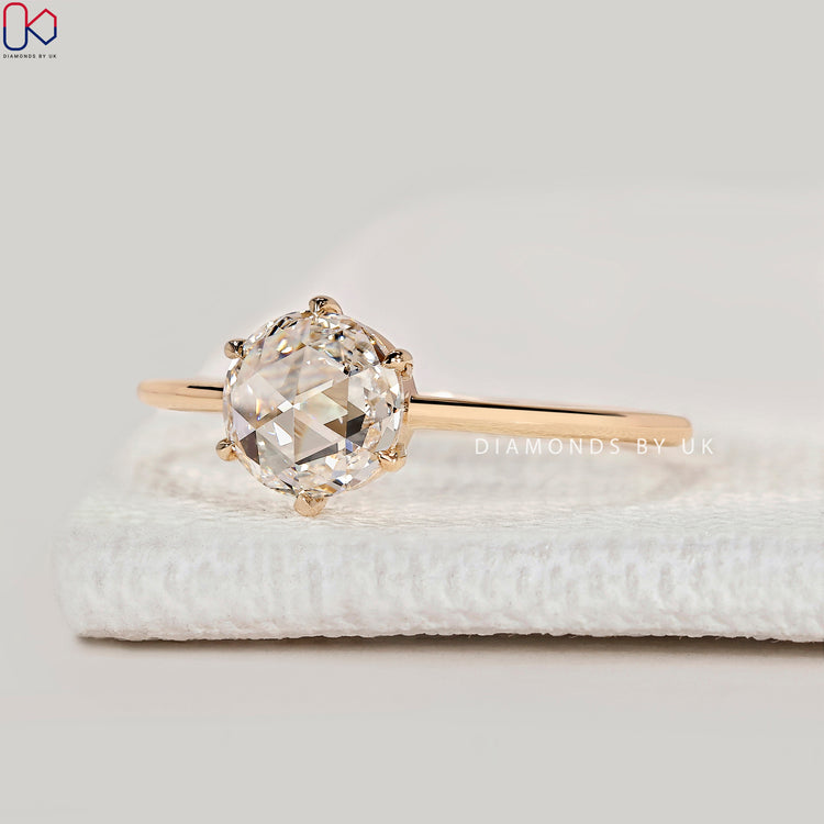 Handmade round rose cut ring with six claw prongs.