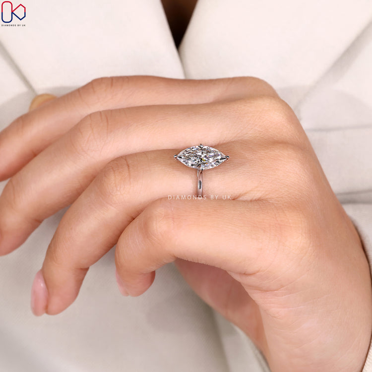 Marquise engagement ring with compass prong setting.