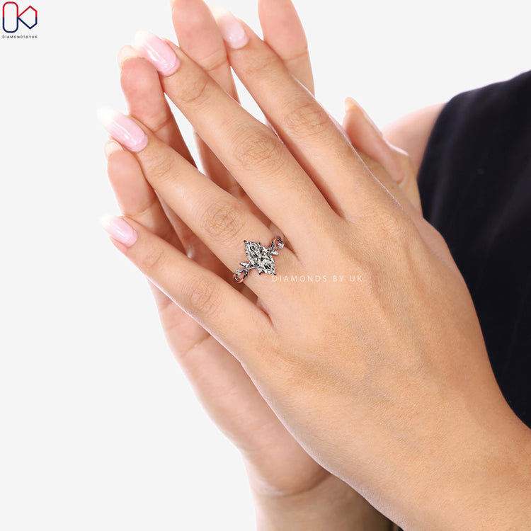 Handmade marquise diamond ring with six claw prongs.
