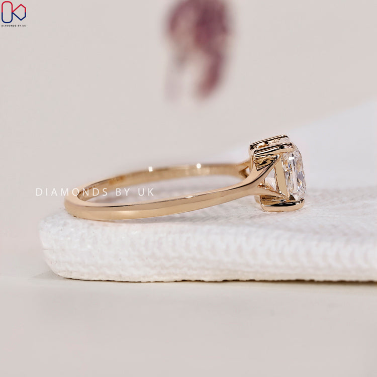 Handmade cushion cut ring with claw prong setting.