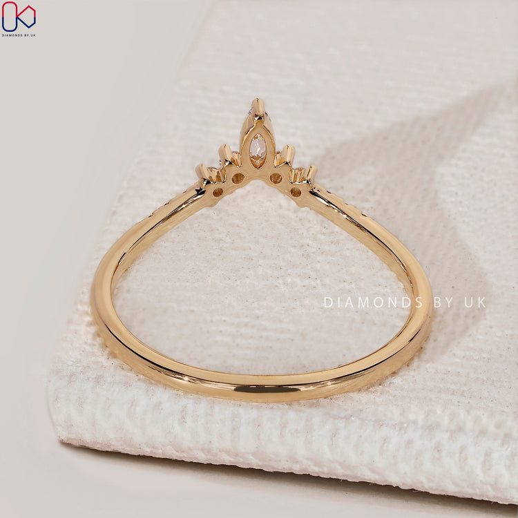 Curved round and marquise diamond band by Diamondsbyuk.
