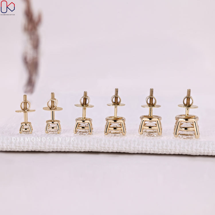 Round diamond stud earrings with secure screw back setting.  