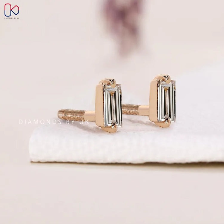 Baguette diamond earrings with a solitaire design.