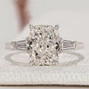 Cushion cut diamond ring with three stone style.
