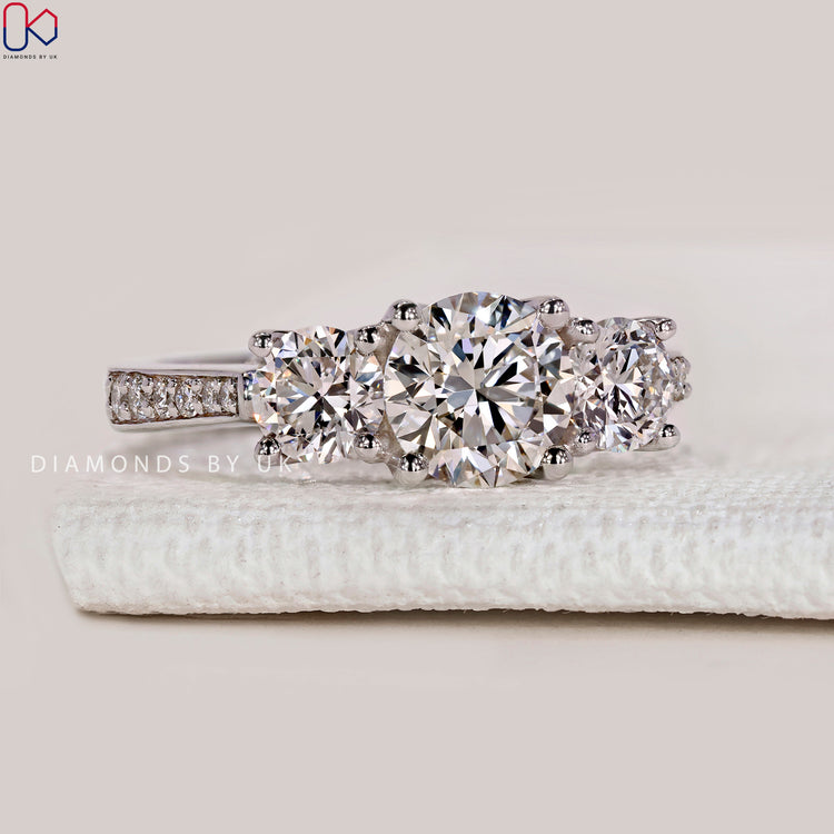 Round cut lab grown diamond ring with cathedral.

