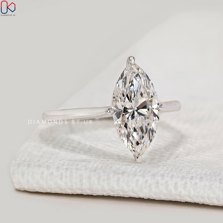 Marquise lab grown diamond ring with compass prongs.