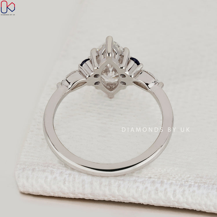 IGI Certified marquise diamond ring with sapphire.
