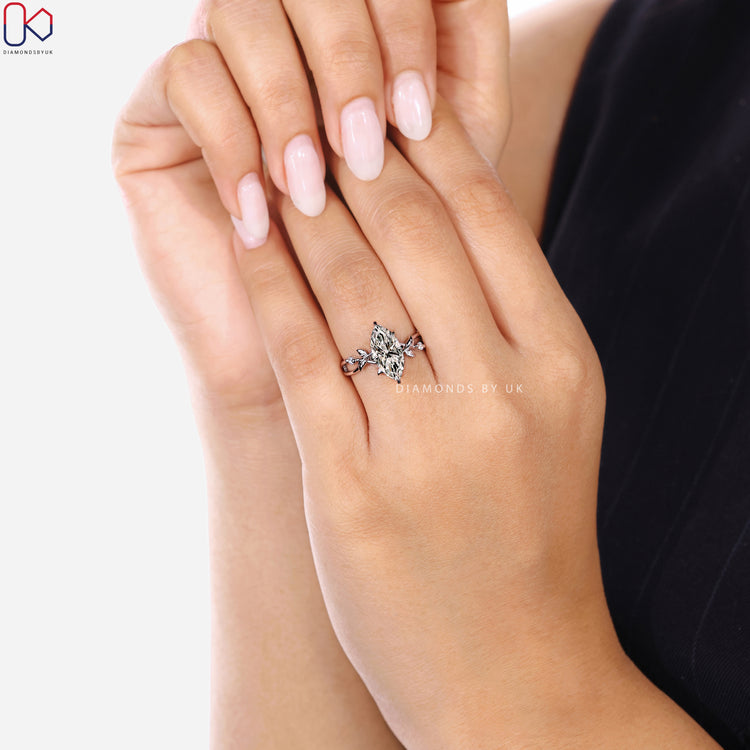 Diamondsbyuk marquise engagement ring with tapered shank.
