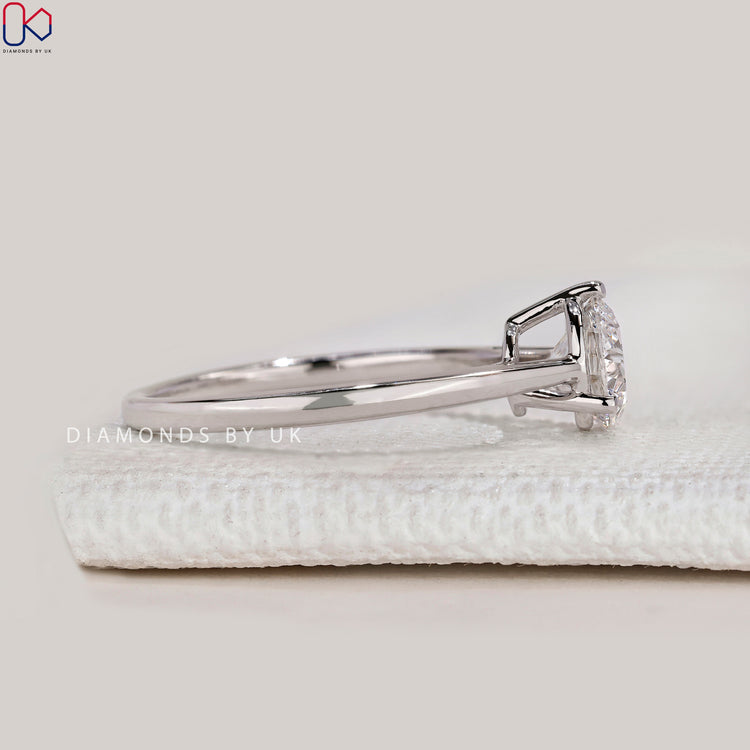 Handmade solitaire ring with cathedral setting.