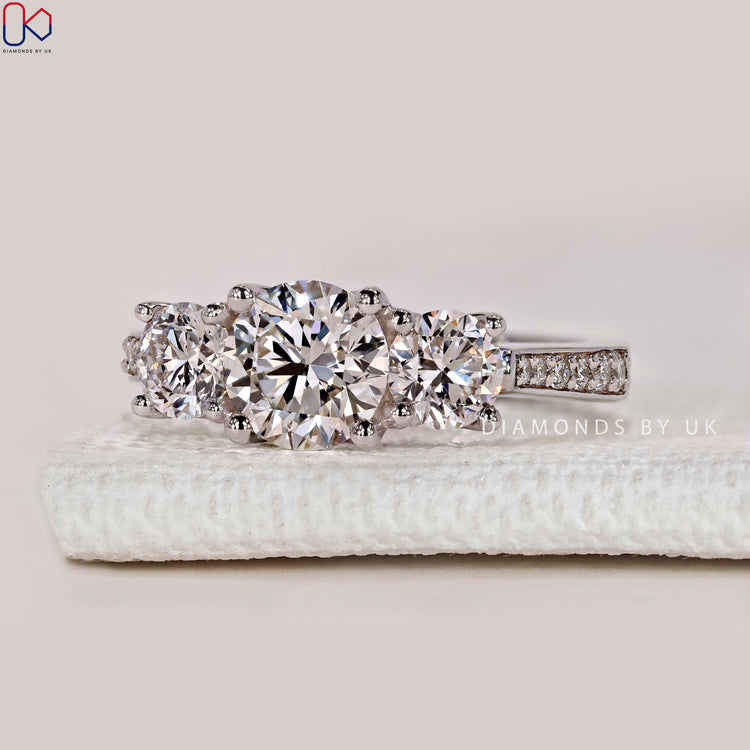 Handmade round ring with four prong setting.