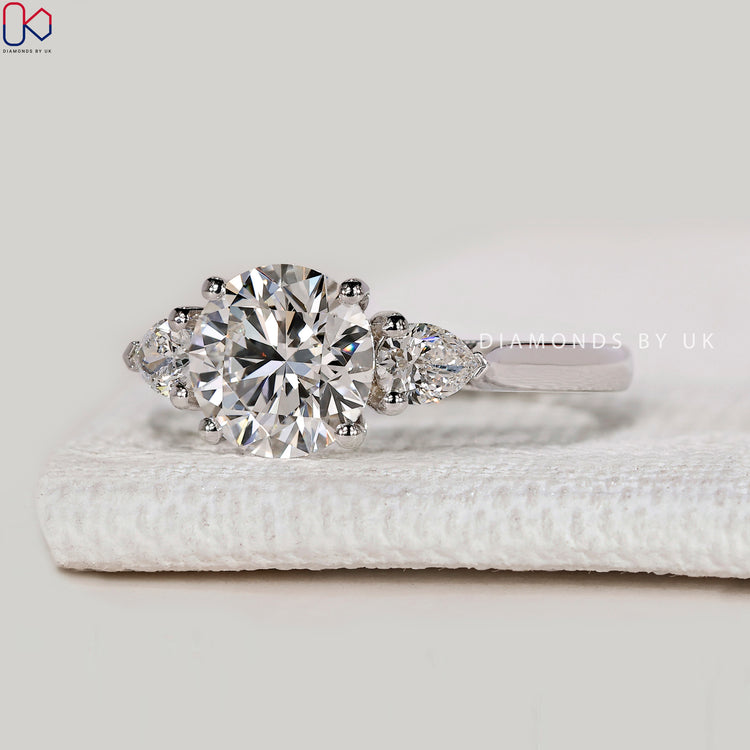 Handmade round ring with cathedral prong setting.