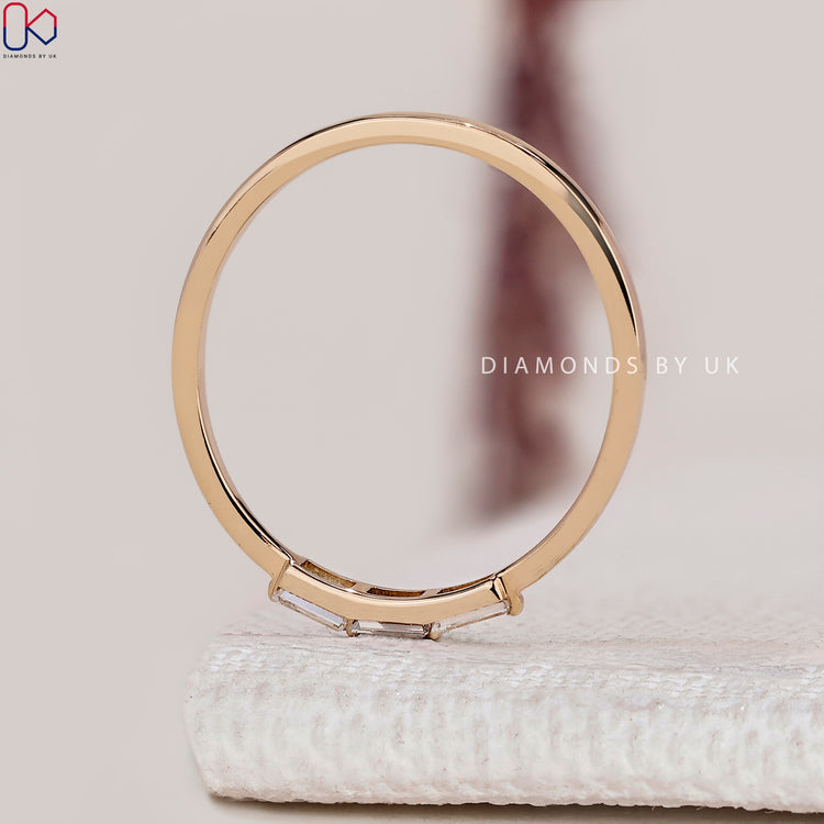 Handmade baguette cut wedding band with three stones.

