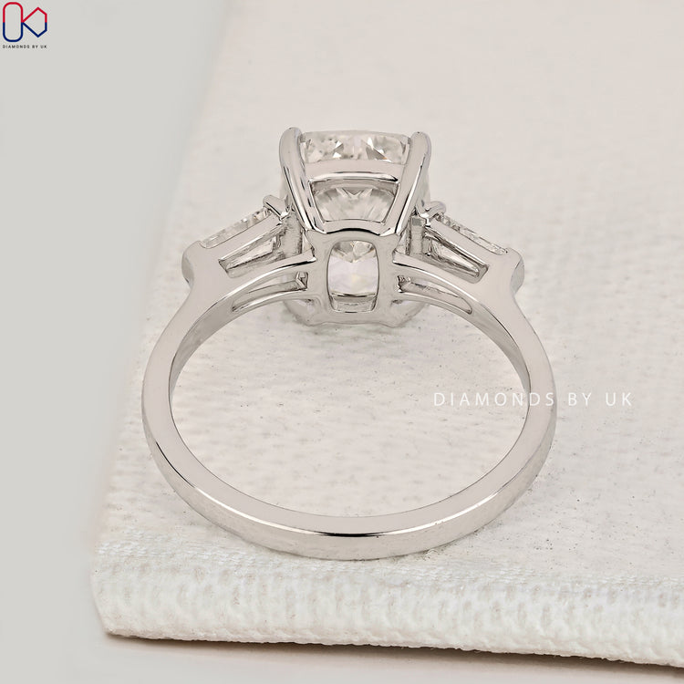 Handmade cushion cut diamond ring with baguette stones.
