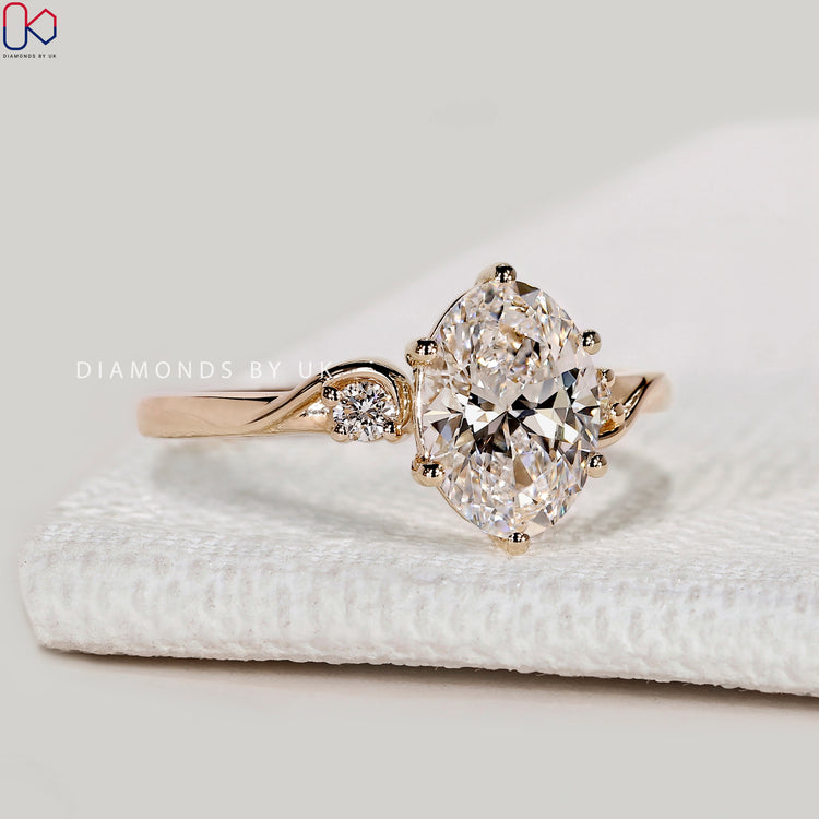 Oval lab grown diamond ring with three stone style.