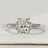 Pear diamond ring with three stone round side design.