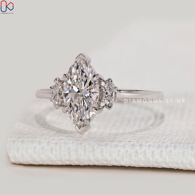 Marquise lab grown diamond ring with three stones.
