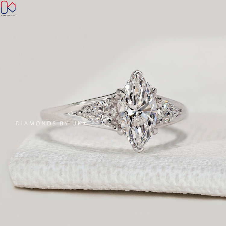 Handmade marquise ring with V and four claw prongs.
