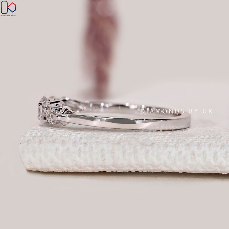 Handmade half eternity diamond band with round stones.