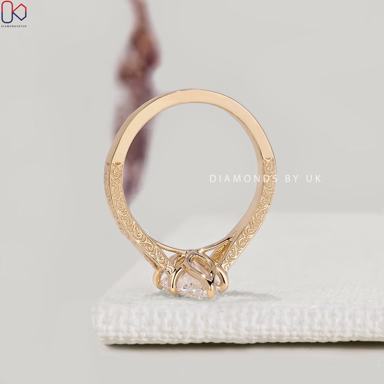 IGI certified marquise diamond ring with six claw prongs.
