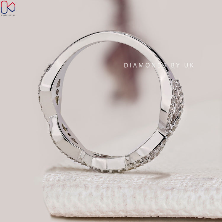 Handmade half eternity wedding band with twisted diamonds.
