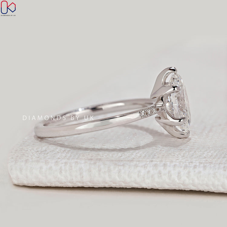 Handmade oval ring with V and claw prong setting.