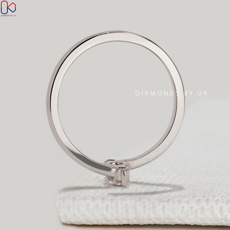 IGI Certified round diamond three stone ring.
