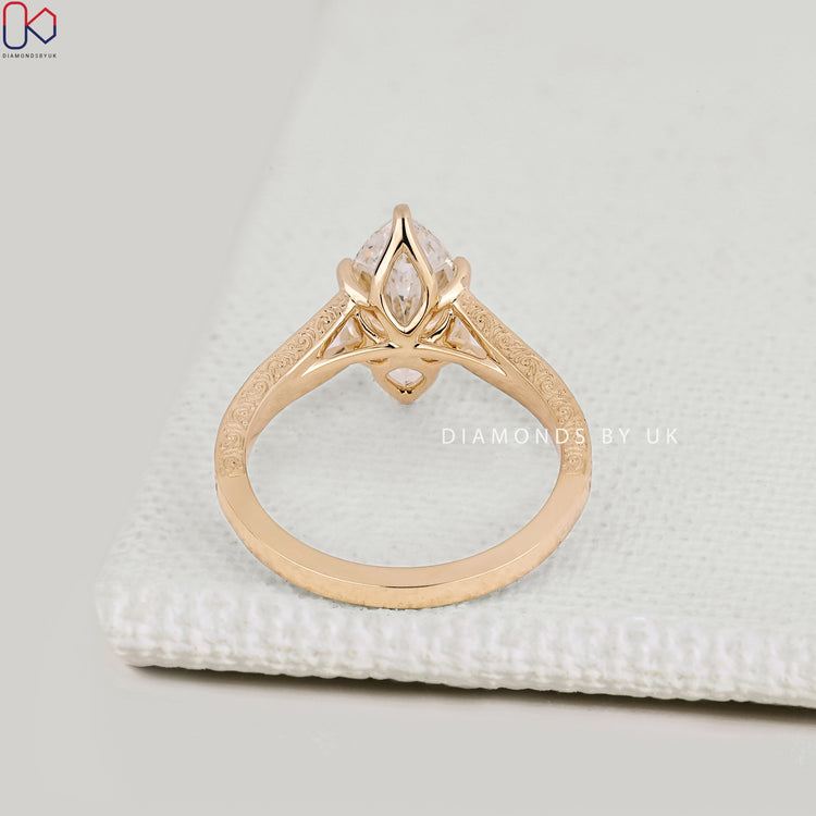 Handmade marquise diamond ring with cathedral setting.
