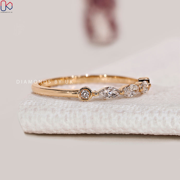Lab grown marquise and round diamond five stone band.
