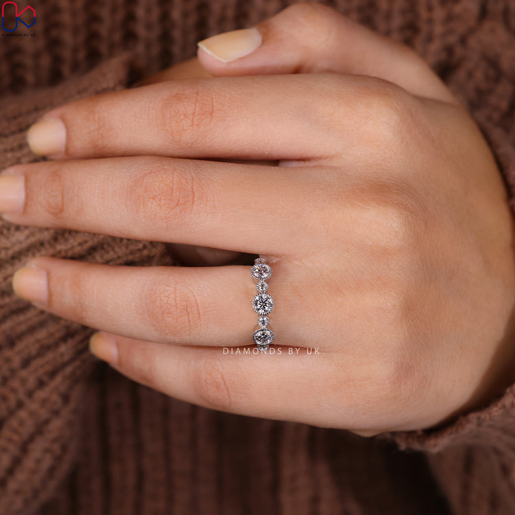 Lab grown diamond band with round stones and milgrain set.
