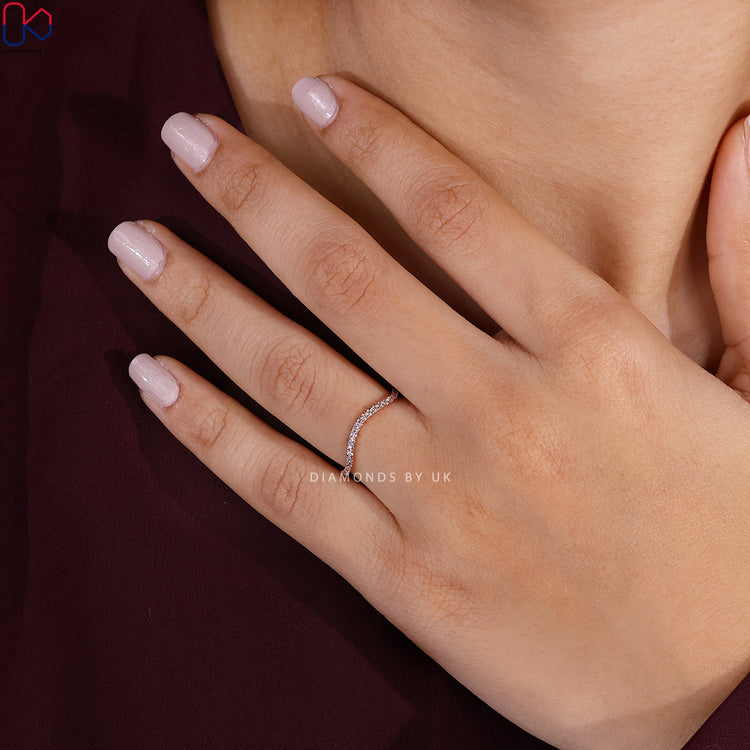 Round diamond wedding band by Diamondsbyuk with wave style.
